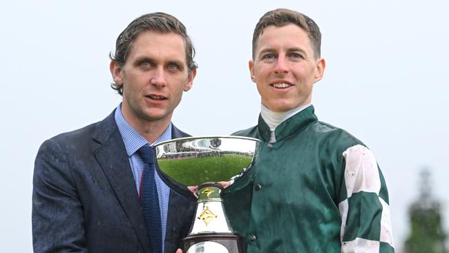 Assistant trainer Charlie Duckworth and jockey Damian Lane with the Turnbull Stakes trophy. Picture: Vince Caligiuri/Getty Images