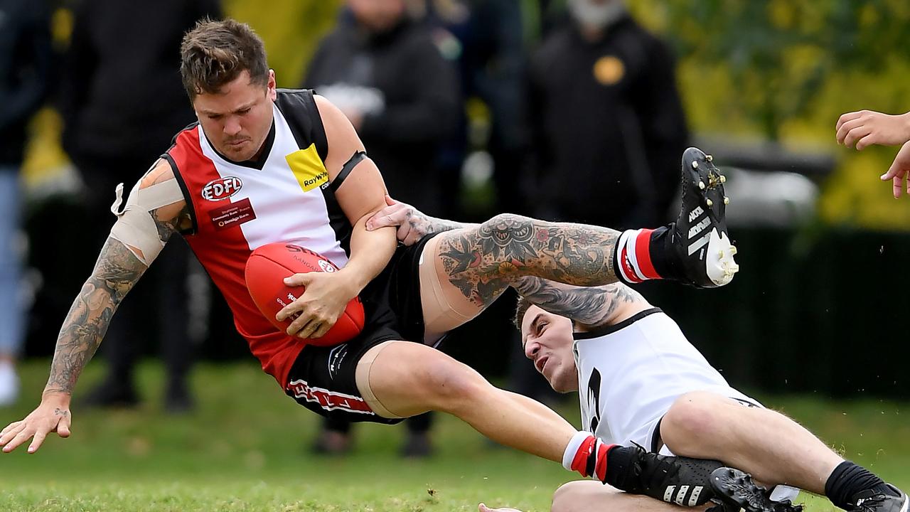 Essendon District: West Coburg’&#149;s Karl Staudt gets dumped by Roxburgh Park opponent Bradley Dimech. Picture: Andy Brownbill