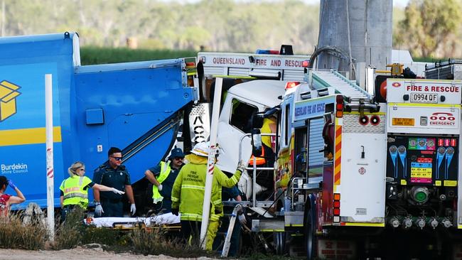 The garbage truck driver was trapped in the vehicle. Picture: Alix Sweeney