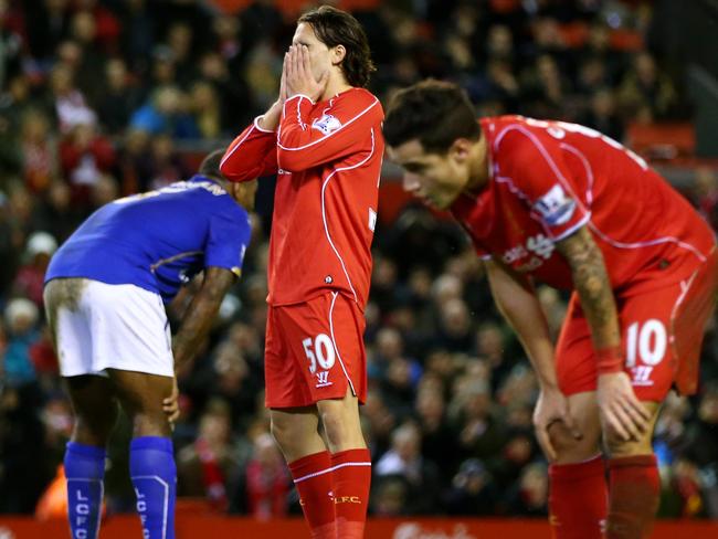 A dejected Lazar Markovic of Liverpool reacts following his team's 2-2 draw.