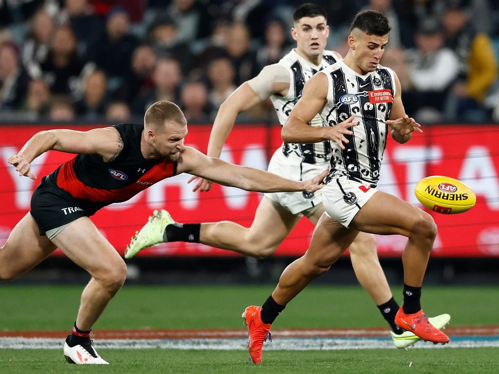 Nick Daicos under pressure from Jake Stringer in the loss to Essendon. Picture: Willson/AFL Photos