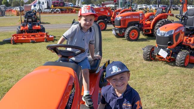 Marcus and his brother play on the tractors at the Gympie District Show 2023. Picture: Christine Schindler