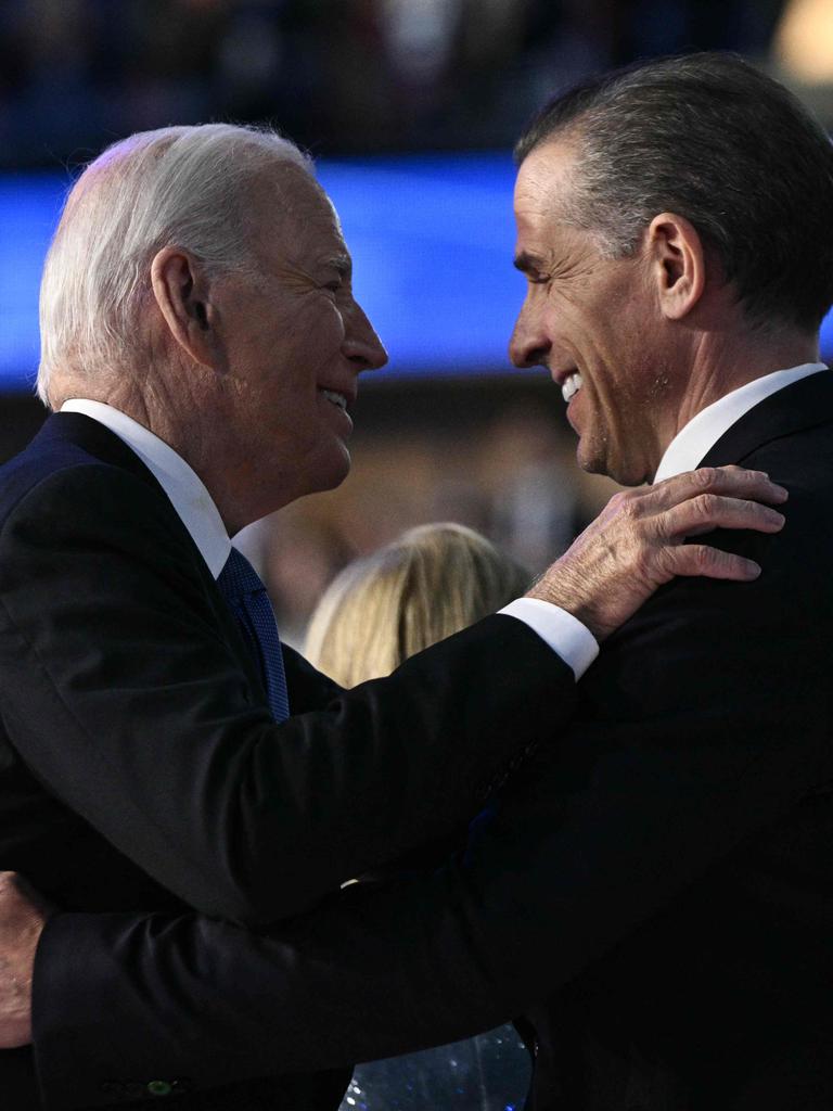 Joe Biden and his son Hunter Biden hug on stage at the conclusion of the first day of the Democratic National Convention. Picture: AFP