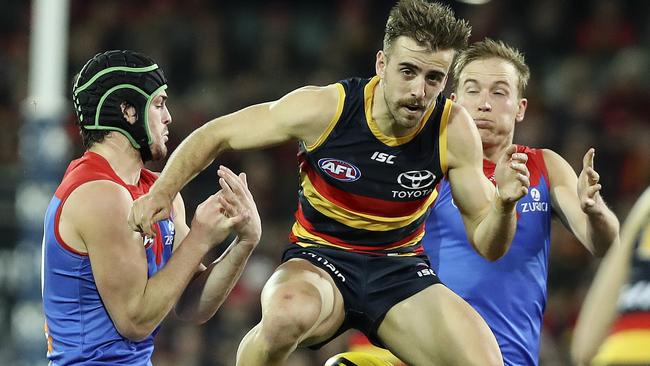 Jordan Gallucci plays tunnel ball with the ball between Angus Brayshaw and Bernie Vince. Picture SARAH REED