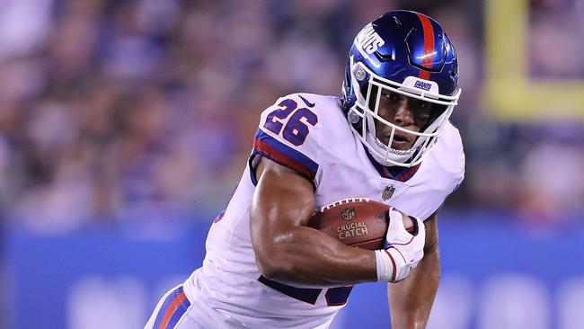 EAST RUTHERFORD, NJ - OCTOBER 11: Saquon Barkley #26 of the New York Giants makes a run against the Philadelphia Eagles during the second quarter at MetLife Stadium on October 11, 2018 in East Rutherford, New Jersey. Elsa/Getty Images/AFP == FOR NEWSPAPERS, INTERNET, TELCOS &amp; TELEVISION USE ONLY ==