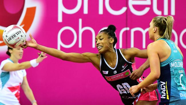 Layla Guscoth of the Thunderbirds reaches for a wide pass in front of Kate Moloney of the Vixens. Picture: Mark Brake/Getty Images