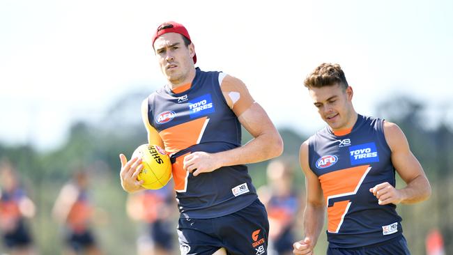 Jeremy Cameron (left) scored just 29 SuperCoach points against the Hawks. 