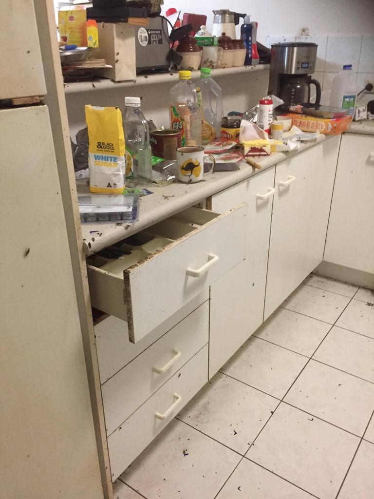 The kitchen at the trashed unit.