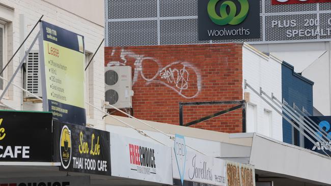 A store for lease and more graffiti close to Australia Fair. Picture Glenn Hampson