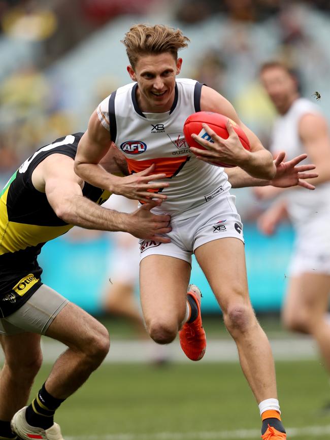 Lachie Whitfield of GWS Giants marks against Richmond in Round 17 at the MCG.