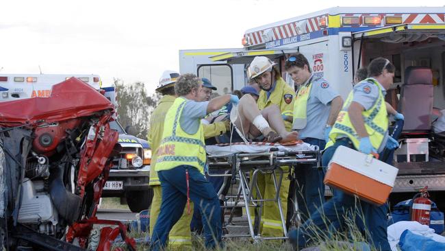 Paramedics work at the scene of a crash near Tiaro in 2006. PicJohnWilson