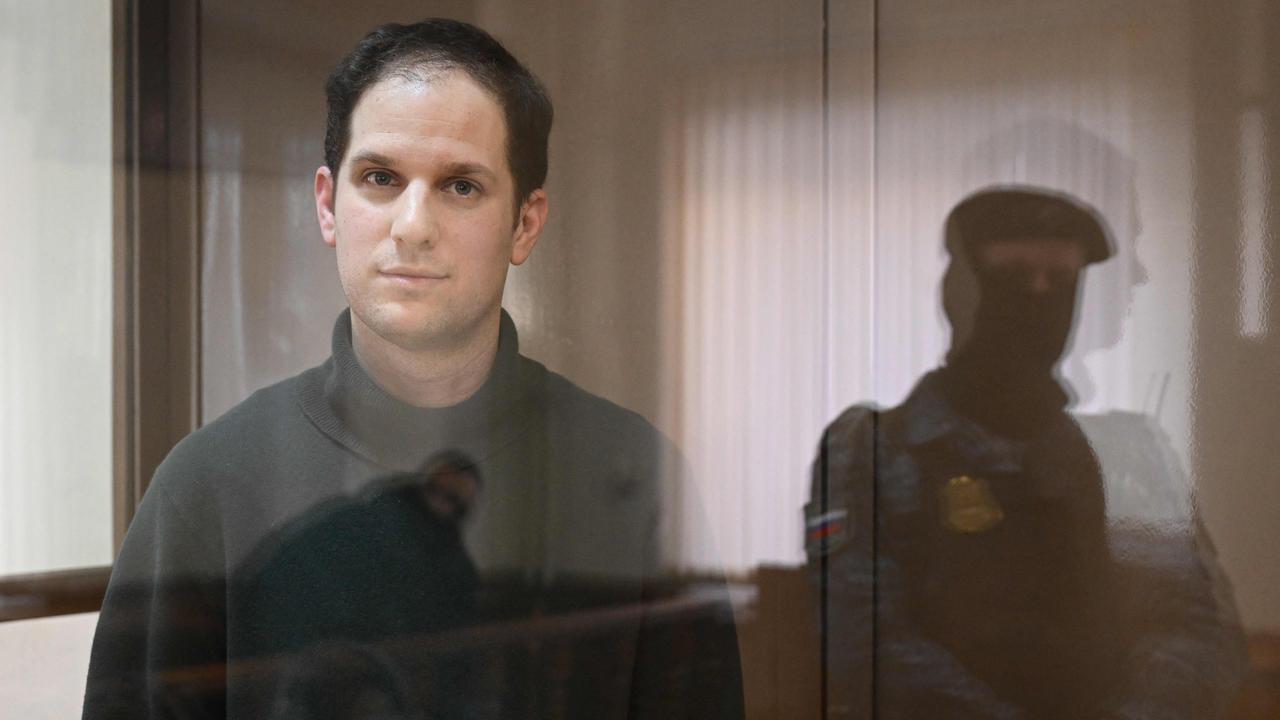 US journalist Evan Gershkovich, arrested on espionage charges, looks out from inside a defendants' cage before a hearing to consider an appeal on his extended pre-trial detention. Picture: AFP