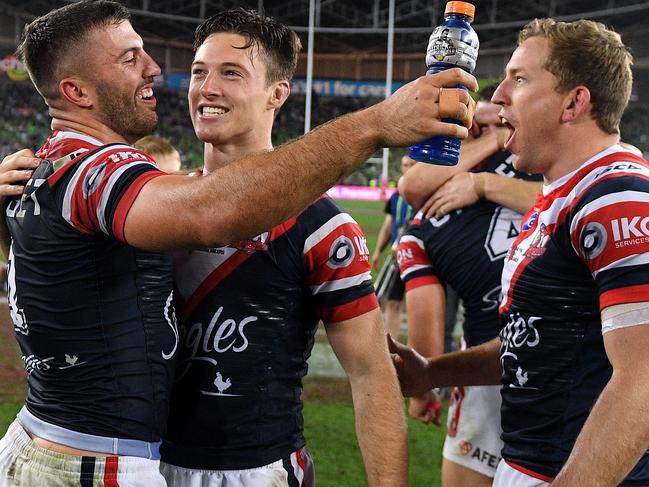 James Tedesco, Sam Verrills and Mitchell Aubusson celebrate following their win over the Raiders in the 2019 NRL Grand Final. Picture: AAP /Dan Himbrechts.