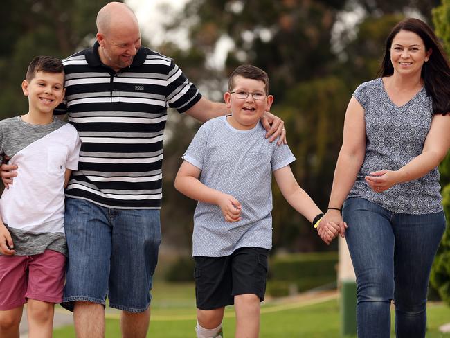 2017: The Carter family takes a stroll — Josh with brother Mitchell, dad Glen and mum Emma.