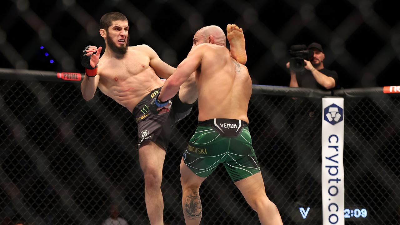 Islam Makhachev of Russia battles Alex Volkanovski of Australia in the UFC lightweight championship fight during UFC 284.