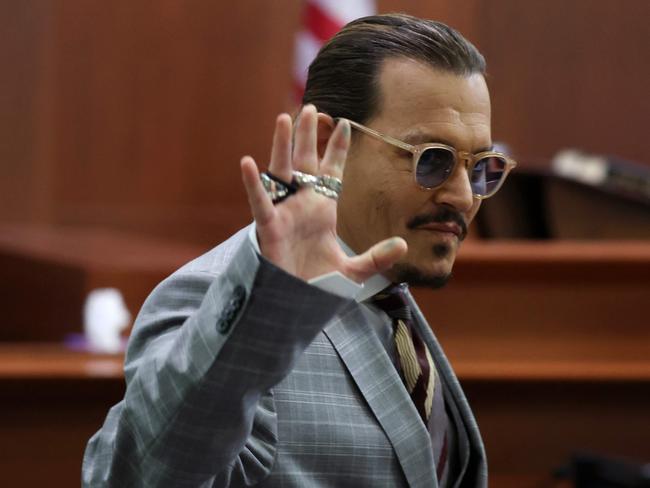 Johnny Depp waves to fans in court. Picture: AFP