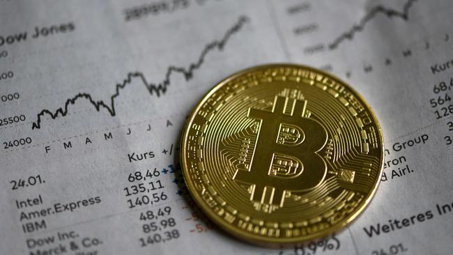 (FILES) In this file photo taken on January 27, 2020 a physical imitation of a Bitcoin is seen in Dortmund, western Germany, on January 27, 2020. - German authorities said on March 15, 2023 they had taken down the "world's largest" money laundering site for cryptocurrency, seizing millions of euros' worth of bitcoin in the process. (Photo by INA FASSBENDER / AFP)