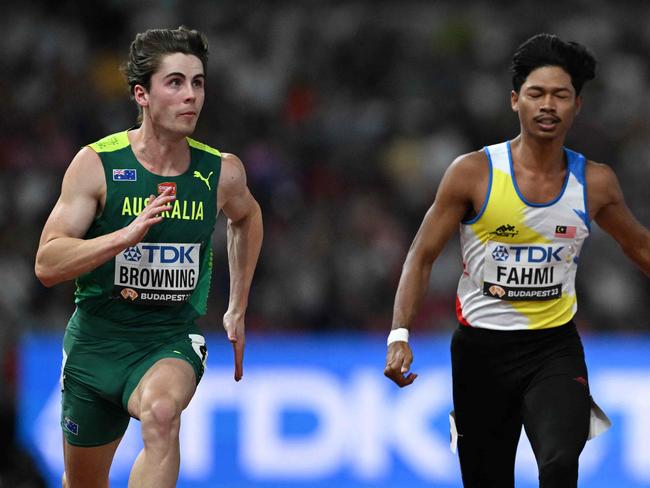 Australia's Rohan Browning crosses the finish line in the men's 100m heats during the World Athletics Championships at the National Athletics Centre in Budapest on August 19, 2023. (Photo by Jewel SAMAD / AFP)