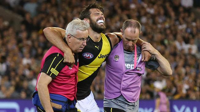 Tiger blow. Richmond’s Alex Rance limps off in the first round, his season over. Picture: Michael Klein