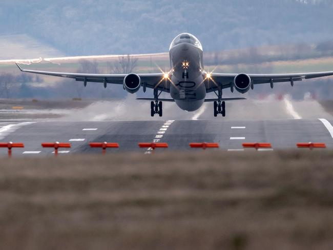 An Airbus airplane of Qatar Airways takes off at the International Airport in Vienna, Austria on a windy February 28, 2020. (Photo by JOE KLAMAR / AFP)