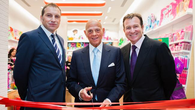 Premier Investments chairman Solomon Lew, centre, cuts the tape to open a new London Smiggle store. Smiggle’s business hit a brick wall in Britain after the Brexit vote, as well as the Covid-19 retail drop.