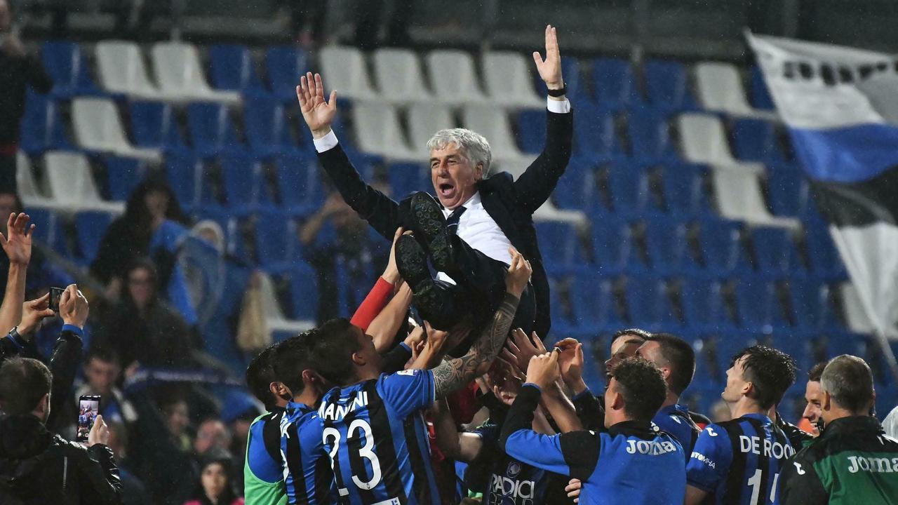Atalanta coach Gian Piero Gasperini is thrown in the air after they sealed their first ever Champions League qualification