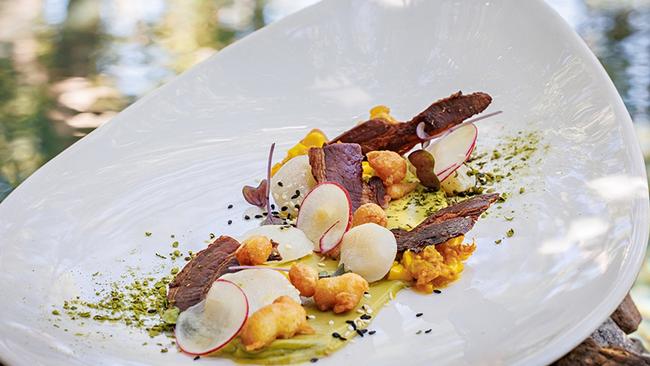 Hervey Bay scallop ceviche, bettel spice, avo, sweet corn, bacon at Osprey's Restaurant at Thala Beach Nature Reserve. Picture: Supplied