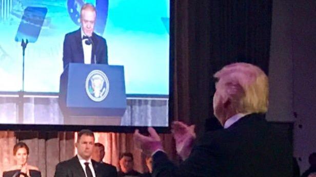 Mr Trump stands to applaud Mr Pratt in New York in May.