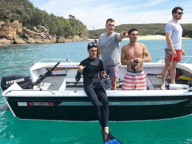 Kurt Kiggins with brother Jai Kiggins, in stripped shorts, and friends before diving with great white sharks yesterday. Picture: Facebook/Kurt Kiggins