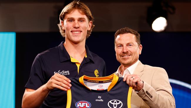 MELBOURNE, AUSTRALIA - NOVEMBER 20: Daniel Curtin is seen with Mark Bickley after being selected at number eight by the Adelaide Crows during the 2023 AFL Draft at Marvel Stadium on November 20, 2023 in Melbourne, Australia. (Photo by Michael Willson/AFL Photos via Getty Images)