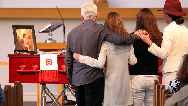 From left, Luke's father Bill Shanahan, sister Mikayla and mother Leanne stand by his coffin. Funeral of Luke Matthew Shanahan at St Faiths Anglican Church, Narrabeen. Picture Craig Greenhill.