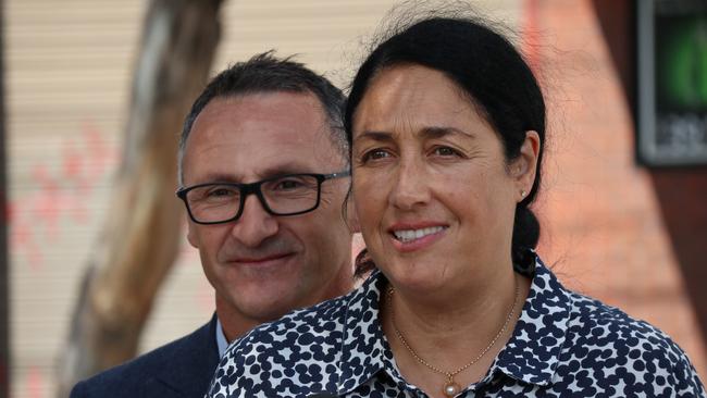 Greens leader Richard Di Natale and Greens candidate for Batman Alex Bhathal speak to the media outside Psarakos market in Thornbury on Monday, February 19, 2018. Di Natale says the Prime Minister should be demanding that George Christiansen apologise for his gun-toting Facebook post. (AAP Image/Alex Murray) NO ARCHIVING