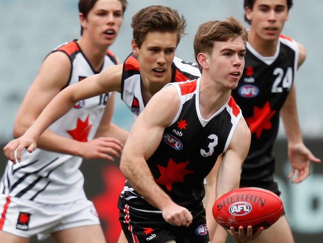 MELBOURNE, AUSTRALIA - SEPTEMBER 28: Taj Schofield of team Brown handballs during the NAB League 2019 All Stars match between Team Dal Santo and Team Brown at the Melbourne Cricket Ground on September 28, 2019 in Melbourne, Australia. (Photo by Darrian Traynor/AFL Photos via Getty Images)