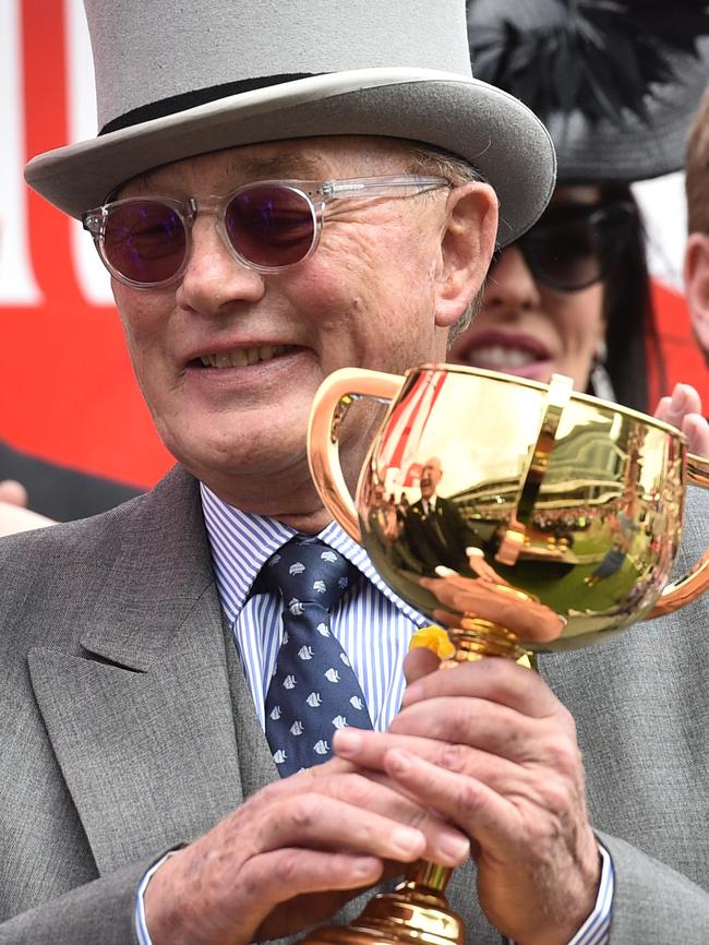 Lloyd Williams holds Melbourne Cup No. 5 after Almandin won our most famous race.