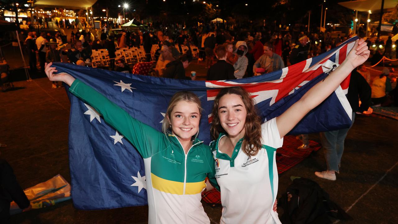 Sisters, triathletes and 2032 Olympic hopefules Erin and Ella Wooldridge celebrate at Kings Beach as Brisbane is announced as the host of the 2032 Olympic Games. Picture: Lachie Millard