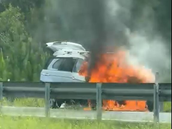 A car engulfed by flames on the Bruce Highway south of the Sunshine Coast. Photo: Facebook