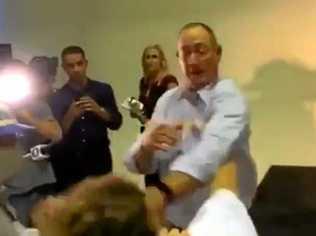 EGGING CONFRONTATION: A protester cracks an egg on Senator Fraser Anning's head during a press conference. Picture: Contributed