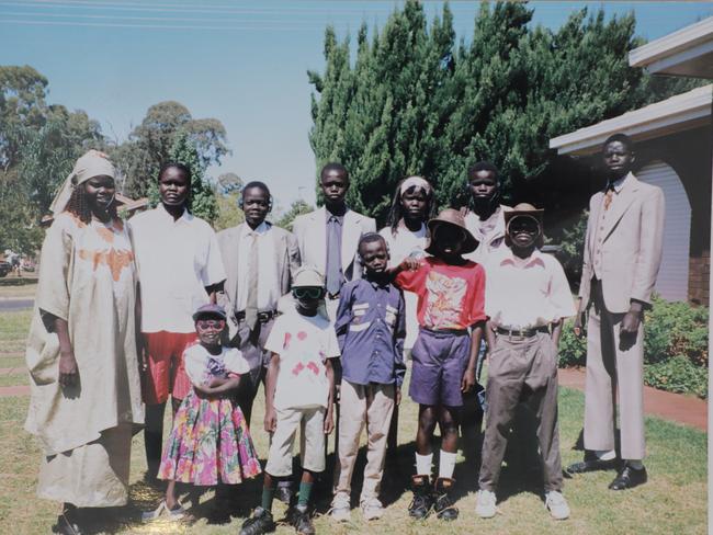 Members of Ayik Chut Deng's family after arriving in Australia in 1996. Ayik is back row, second from right.