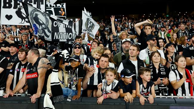 MELBOURNE, AUSTRALIA – APRIL 25: Collingwood fans celebrate during the 2023 AFL Round 06 match between the Collingwood Magpies and the Essendon Bombers at the Melbourne Cricket Ground on April 25, 2023 in Melbourne, Australia. (Photo by Dylan Burns/AFL Photos via Getty Images)