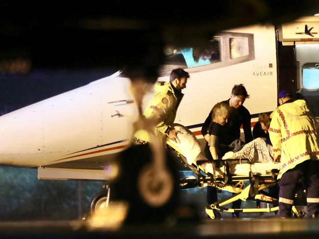 The woman is assisted by paramedics at Coolangatta Airport. Picture: Supplied