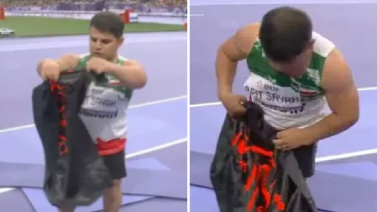 Iranian athlete stripped of gold medal over banned flag