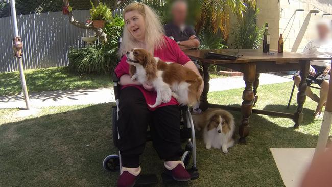 Cerebral palsy sufferer and neglect victim Annie Smith in 2011, with her dogs Maggie and Deana. Picture: SAPOL