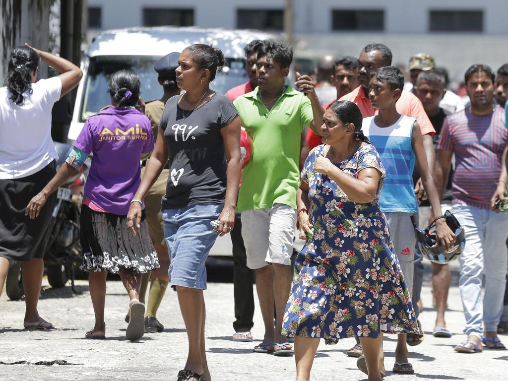 Relatives gather outside a hospital following blasts in Colombo, Sri Lanka. Picture: AP