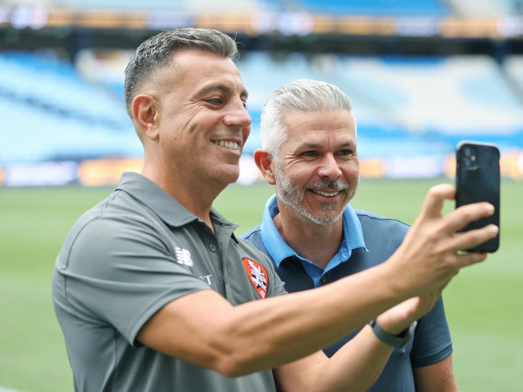 Rival coaches Ross Aloisi (left) and Steve Corica smile for a ‘selfie’ ahead of the Australia Cup final between Brisbane Roar and Sydney FC. Picture: Mark Evans/Getty Images