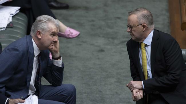 Workplace Relations Minister Tony Burke confers with Prime Minister Anthony Albanese during question time on Tuesday. Picture: NCA NewsWire / Gary Ramage