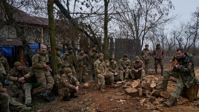 Acclaimed Ukrainian singer Kolia Cerga performs for Ukrainian soldiers of the 59th brigade near the frontline on December 25, 2022 in Donetsk. Picture: Getty Images