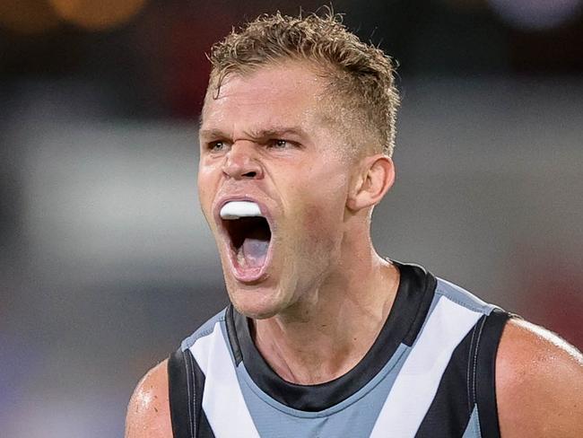 BRISBANE, AUSTRALIA - MARCH 19: Dan Houston of the Power celebrates a goal during the 2022 AFL Round 01 match between the Brisbane Lions and the Port Adelaide Power at The Gabba on March 19, 2022 In Brisbane, Australia. (Photo by Russell Freeman/AFL Photos)