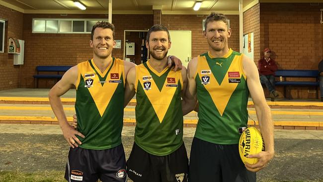 Former Hawthorn captain Ben McEvoy, right, at Colbinabbin football training with brothers Peter, left, and Matt, centre, last week. Picture: Supplied