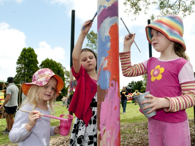 Painting totems at the Maridahdi Early Childhood Community School market day at Picnic Point are Ayesha Pierssene, Ruby Heffernan, Ella Pierssene. (Photo: Nev Madsen)