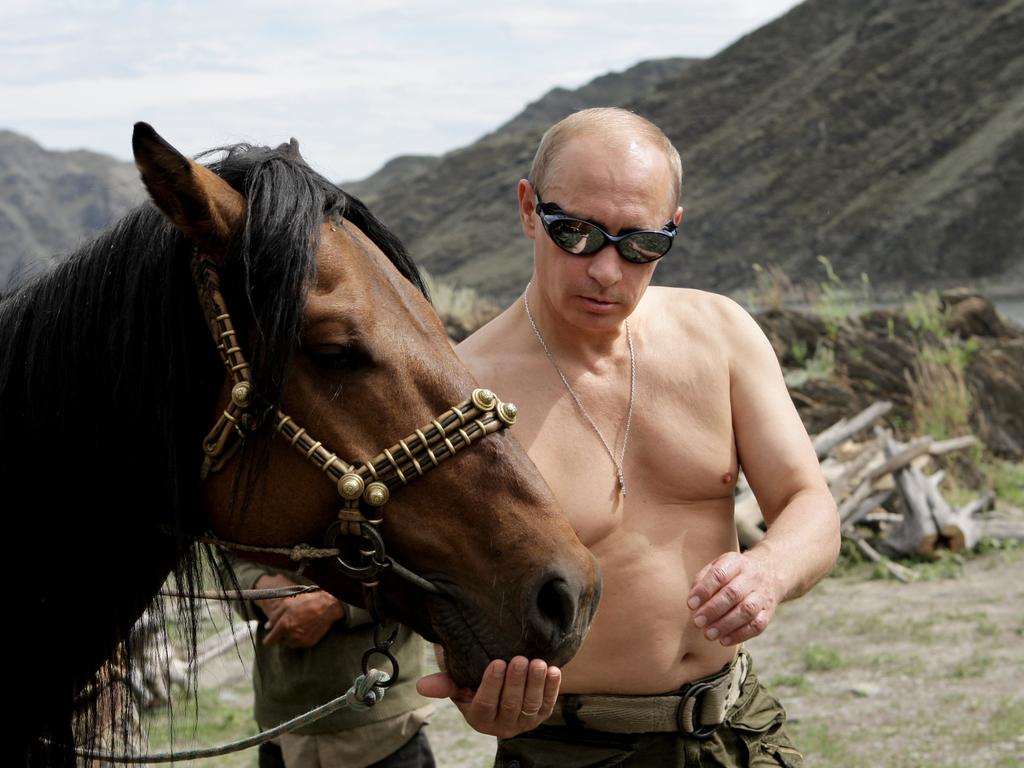 Russia’s Vladimir Putin pictured with a horse during his vacation in 2009. Picture: AFP